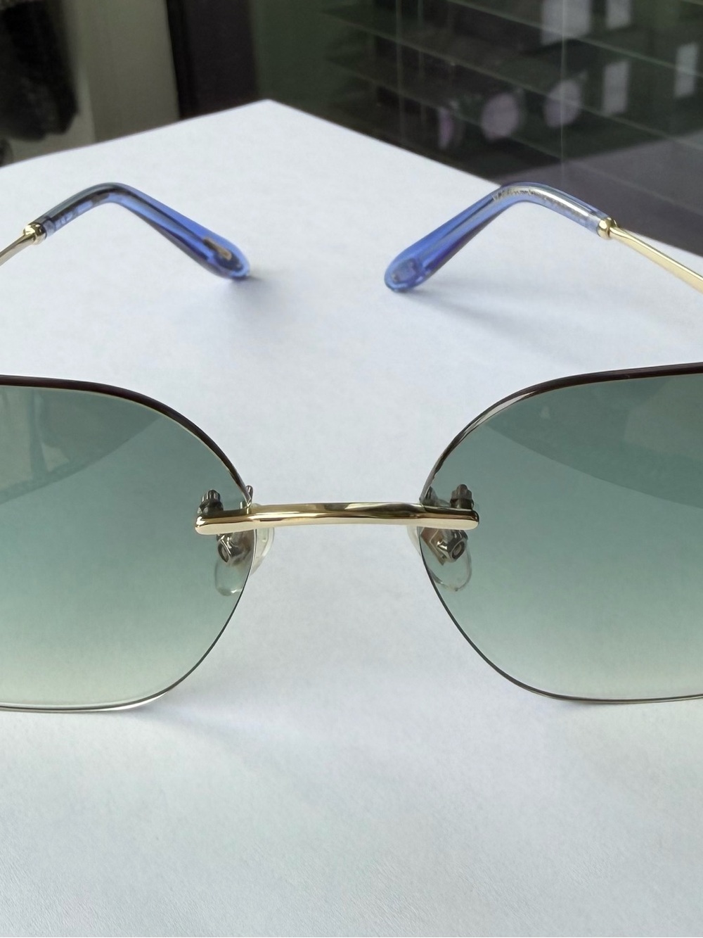 Chopard Rimless Sunglasses with Gradient Green Lenses and Gold Bridge